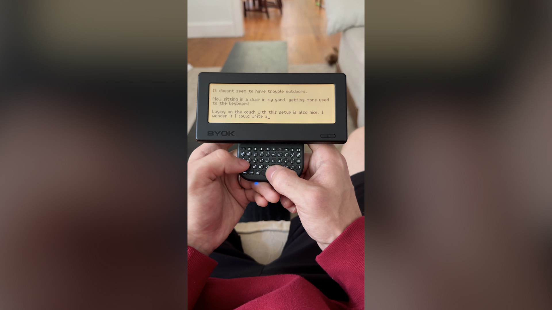 BYOK attached to the Clicks Power Keyboard, held for on-the-go typing