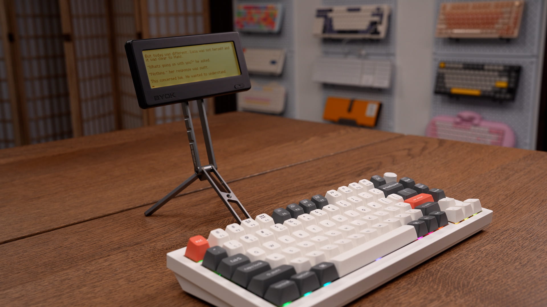 BYOK mounted on a metal tripod stand above a Keychron Q1 Ultra keyboard